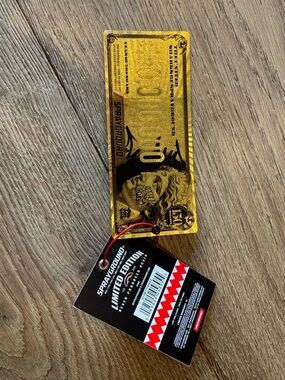 Sprayground Gold Novelty Tag with Black Limited Edition Tag